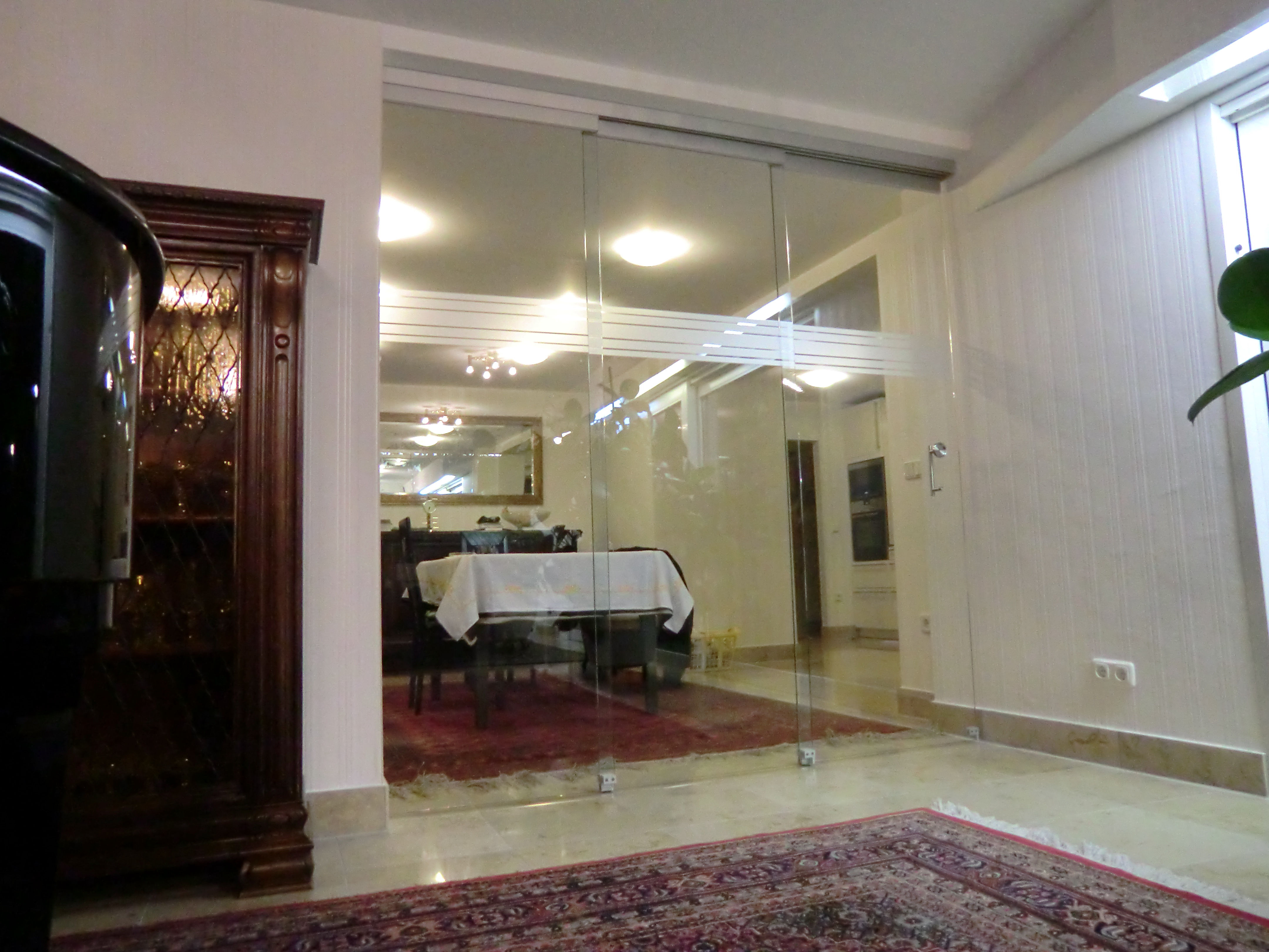 Dreiteilige Ganzglas-Schiebetüre von Glas Scholl