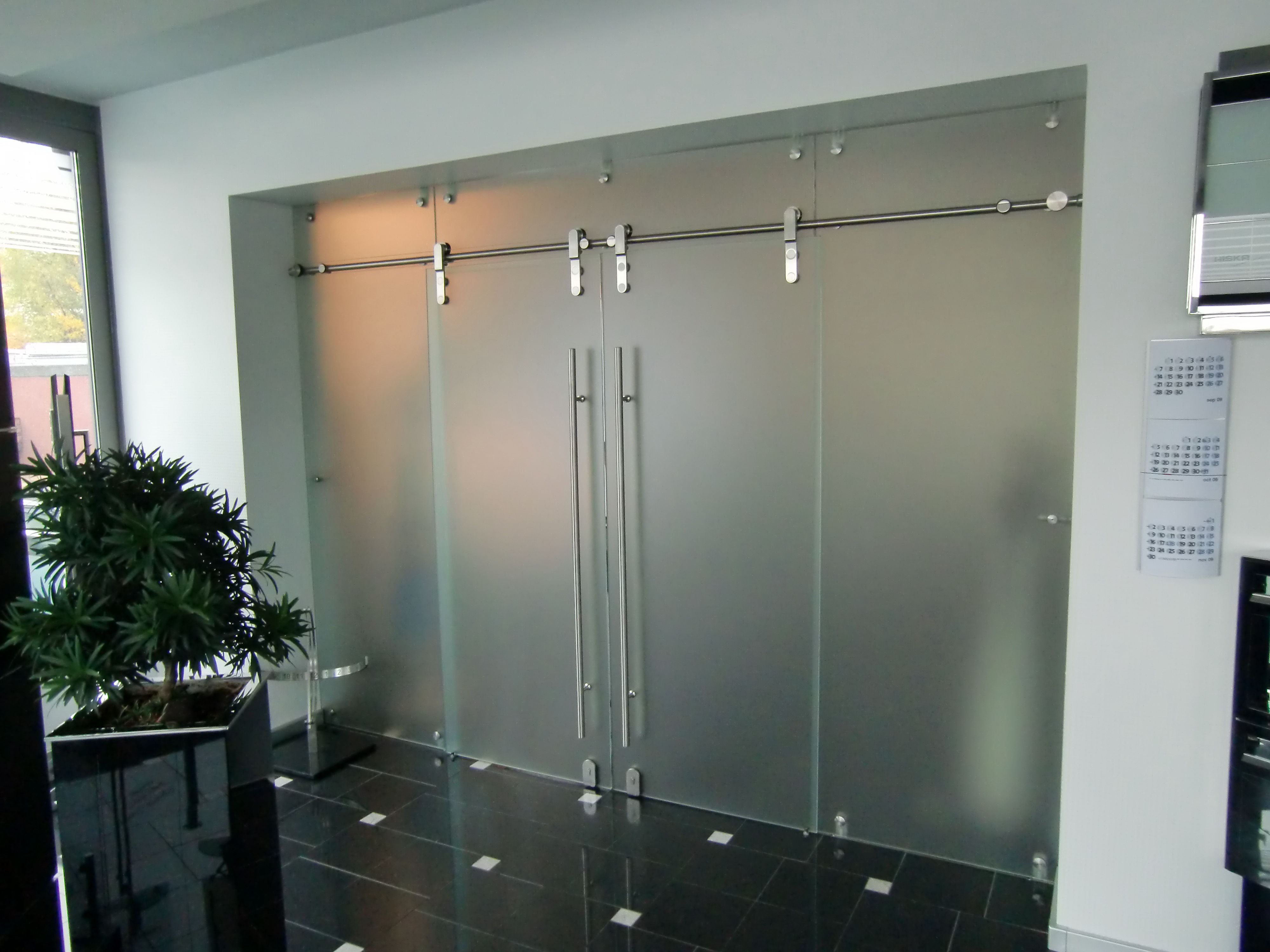 Schiebetür mit synchronem Edelstahl-System von Glas Scholl